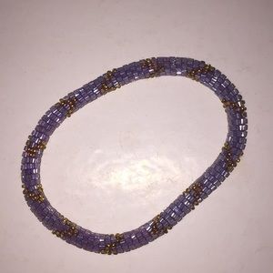 Purple and gold hand beaded bracelet